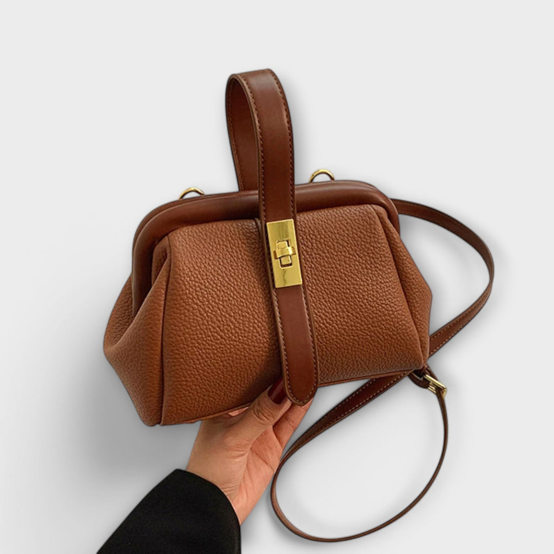 Elegant women's leather mini handbag with a secure turn lock, perfect for evenings or daily style.