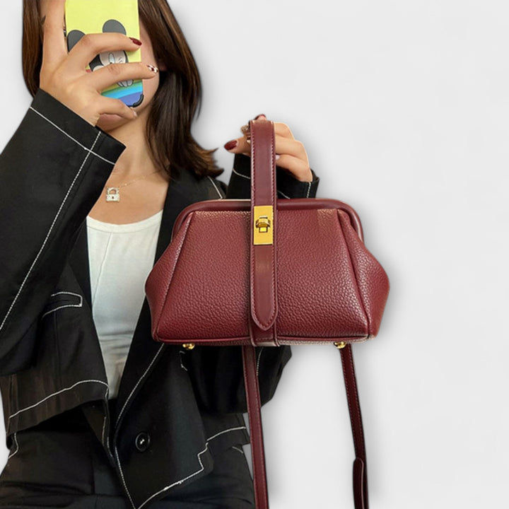 Chic women's leather mini crossbody purse, an essential fashion statement with a reliable turn lock.