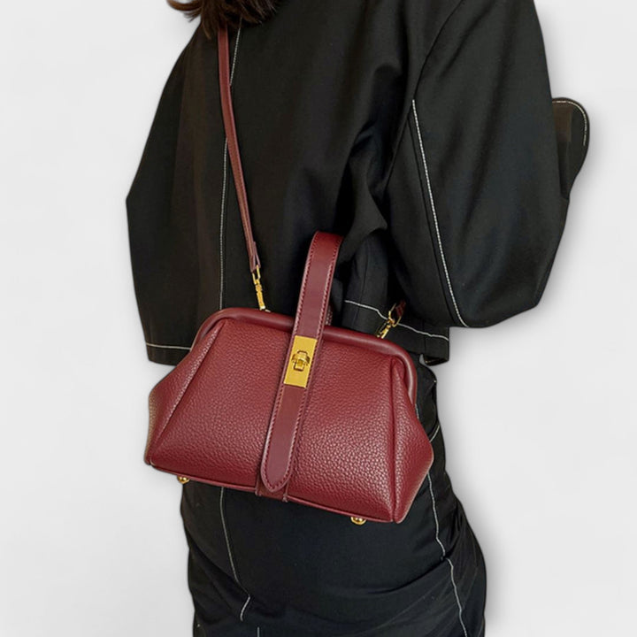 Versatile ladies' leather mini bag, can be worn as a shoulder or crossbody, secured by a turn lock.