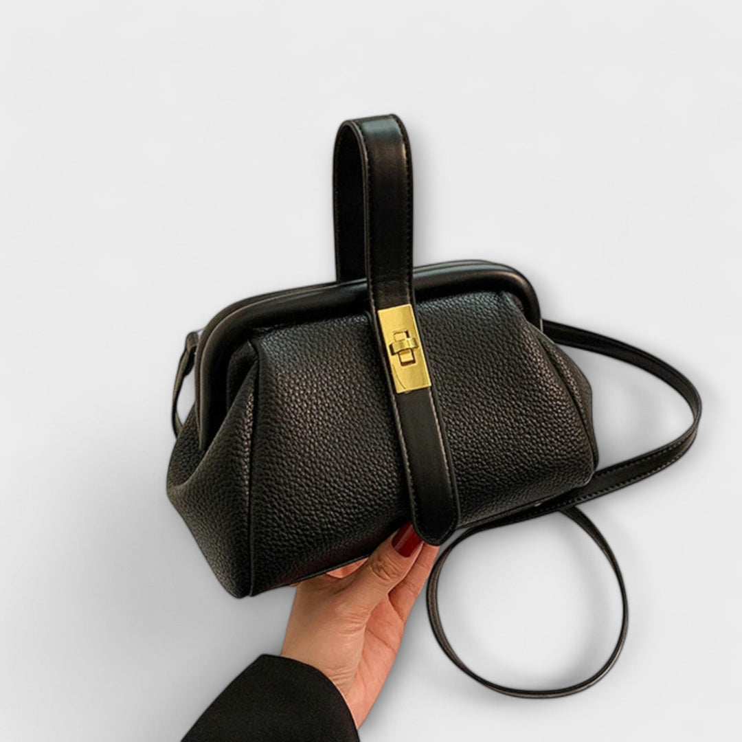 Modern women's mini leather purse with a sophisticated turn lock, perfect to elevate any outfit.