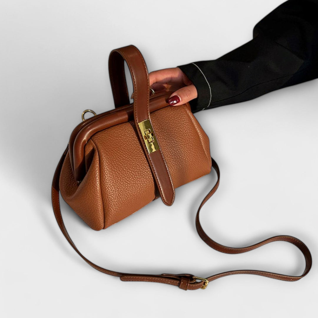 Designer mini leather handbag for women, versatile as shoulder or crossbody, with a unique turn lock.