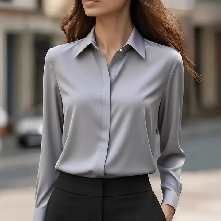 Classic white women's blouse, a sophisticated long sleeve top for elegant everyday wear.