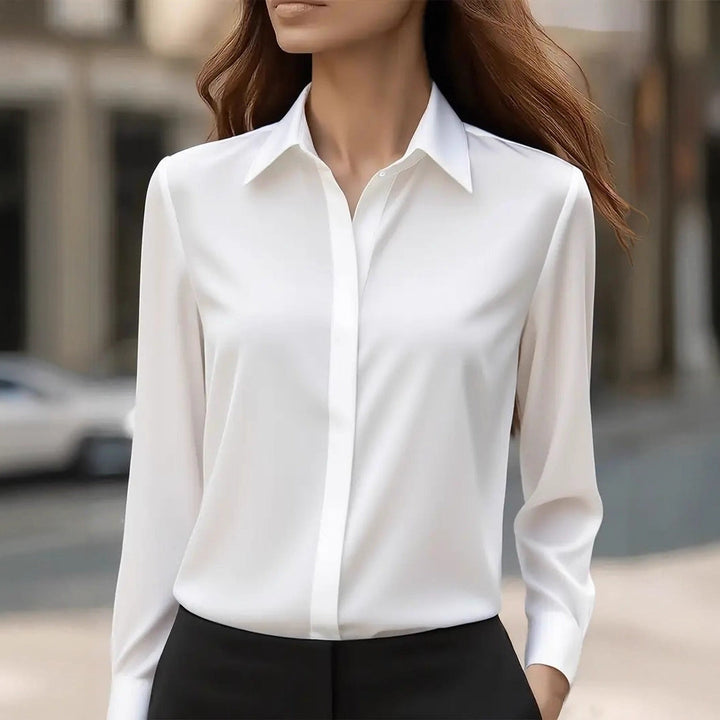 Timeless women's button-up blouse, ideal for versatile work and casual fashion.