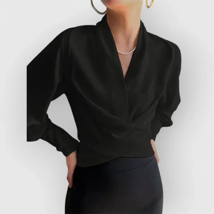Flowy women's wrap blouse with long sleeves, offering a comfortable yet elegant style for work and daily wear.