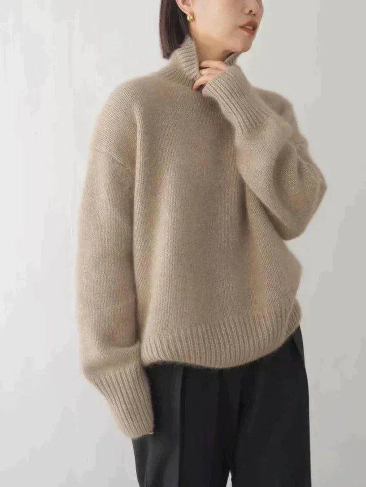 Elegant women's luxe turtleneck sweater in a cozy knit, perfect for sophisticated winter fashion.