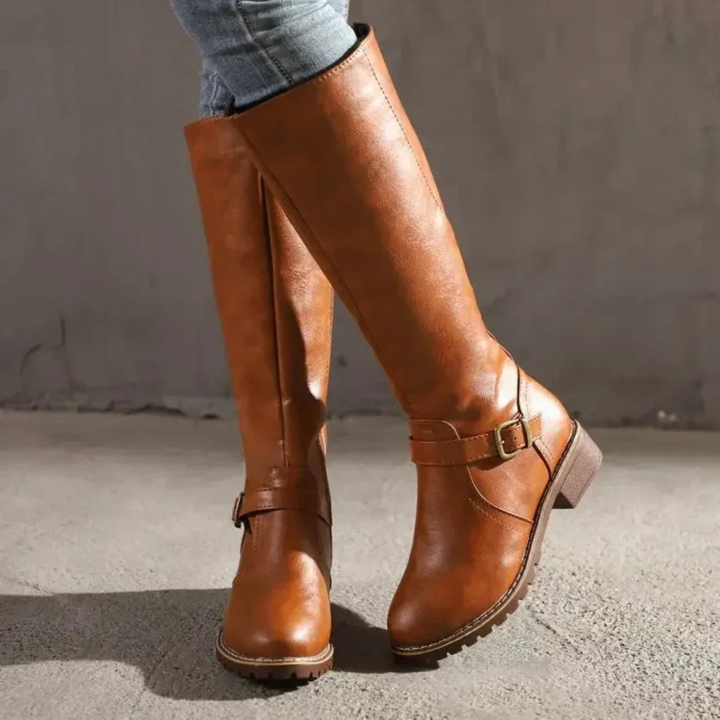 Elegant women's mid-calf boots, perfect for stylish fall & winter outfits. Comfortable classic design.