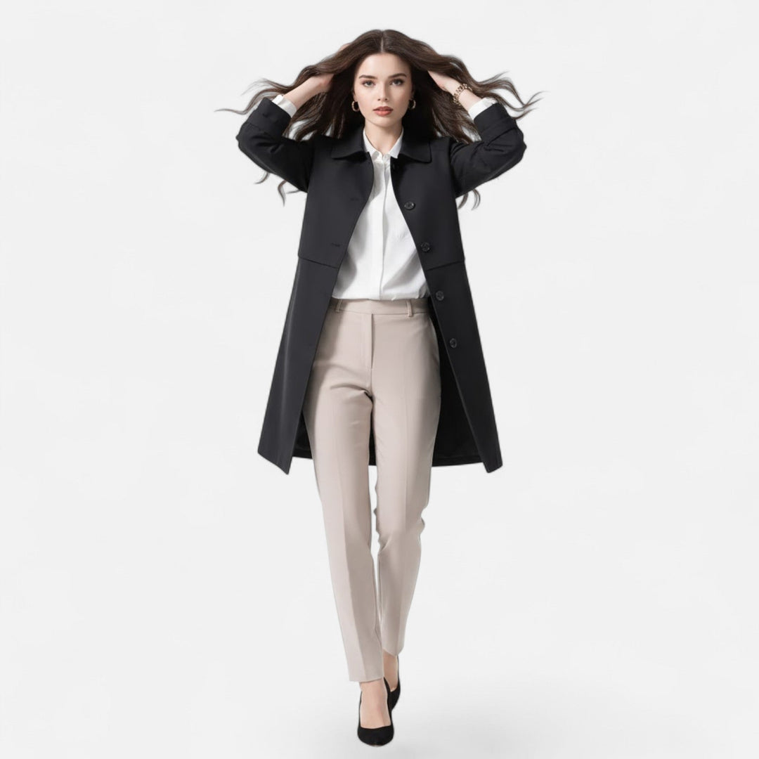Stylish women's mid-length trench coat, tailored fit, versatile outerwear for professional or casual autumn looks.