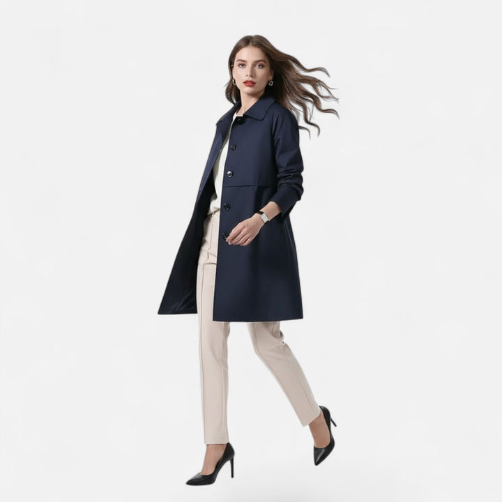 Sophisticated women's mid-length trench coat, an elegant and versatile outerwear piece for urban spring fashion.