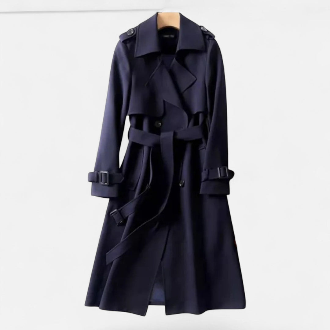 Mid-length women's trench coat, classic style. Accented with a tie-waist for sophisticated fashion.