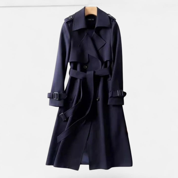 Mid-length women's trench coat, classic style. Accented with a tie-waist for sophisticated fashion.