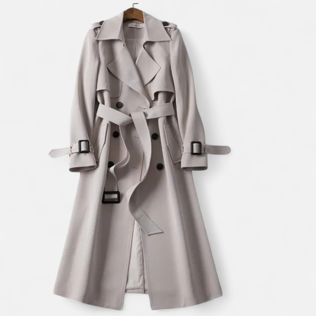 Fashionable women's mid-length elegant trench coat. Features a tie-waist for a flattering silhouette.
