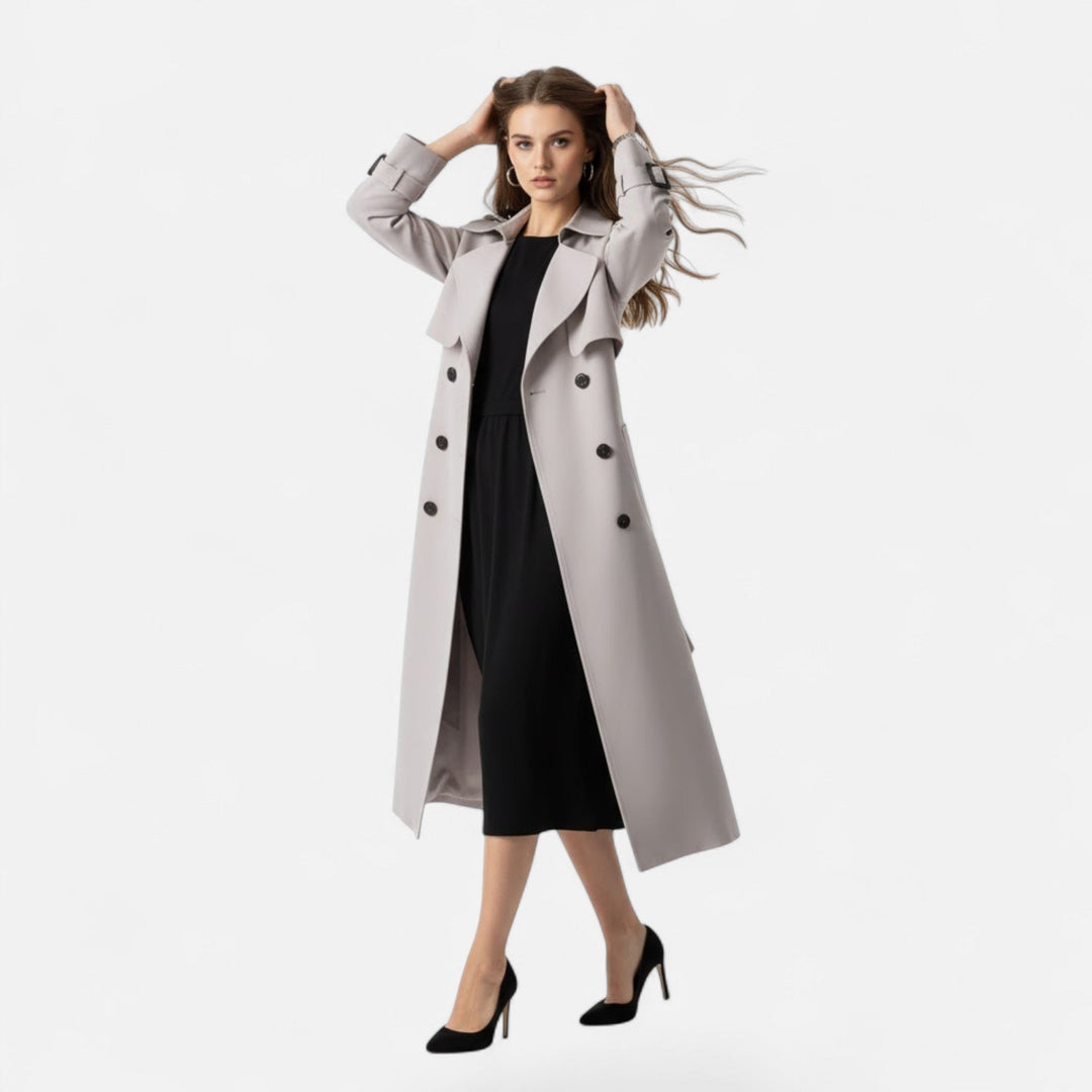 Elegant women's outerwear: a mid-length trench coat with stylish tie-waist. A classic fashion staple.