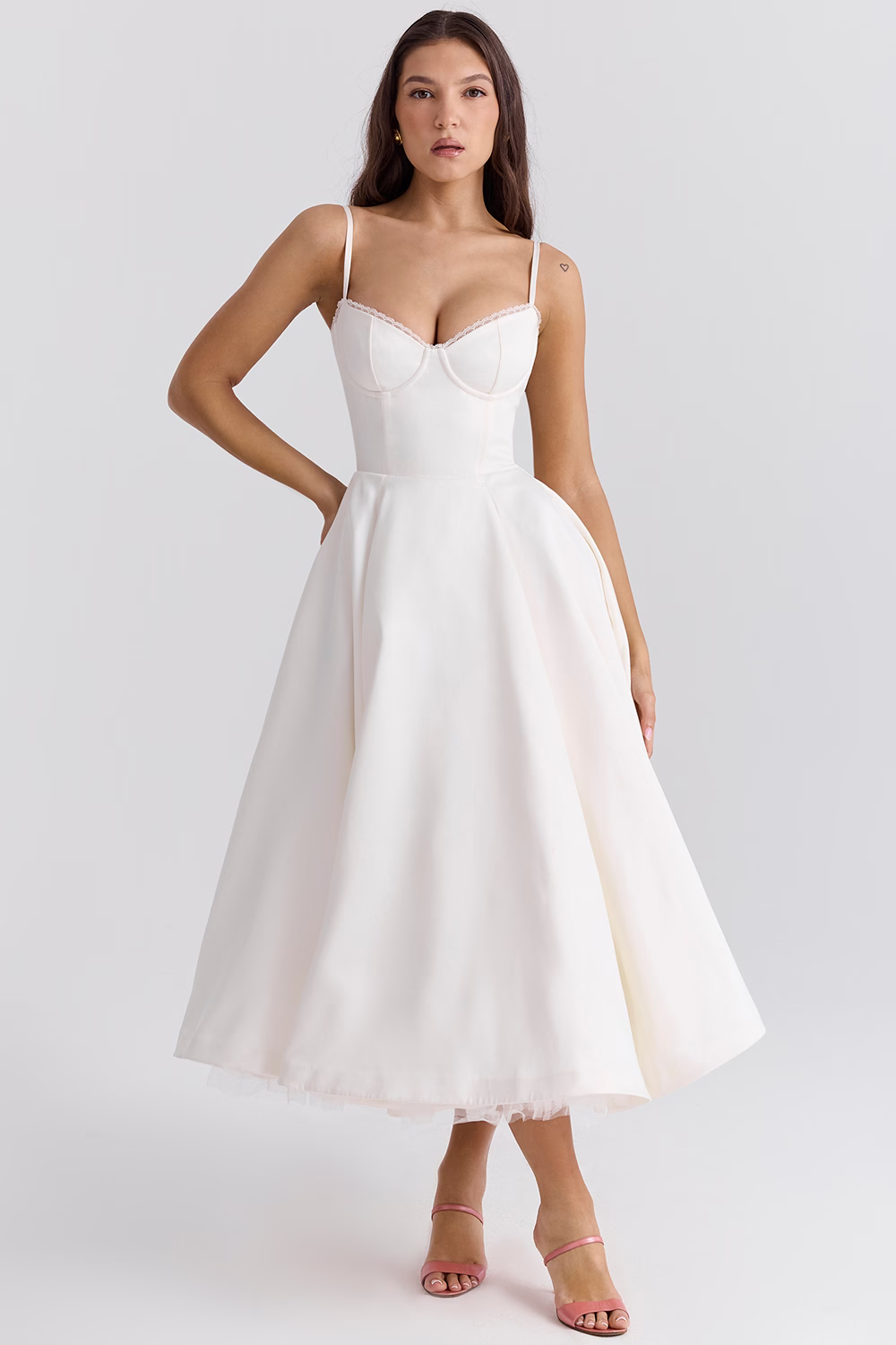 Formal midi bridesmaid dress, featuring a classic corset bodice, adjustable straps, & pockets.