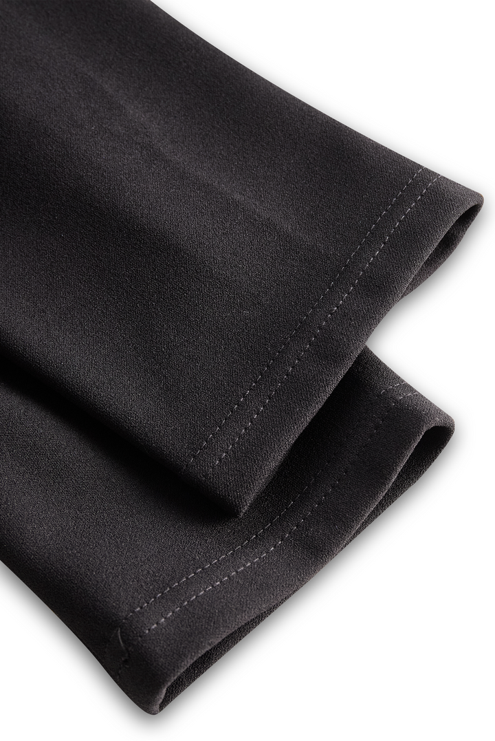 Texture detail of the fabric for a women's elegant midi graduation dress with a mandarin collar.