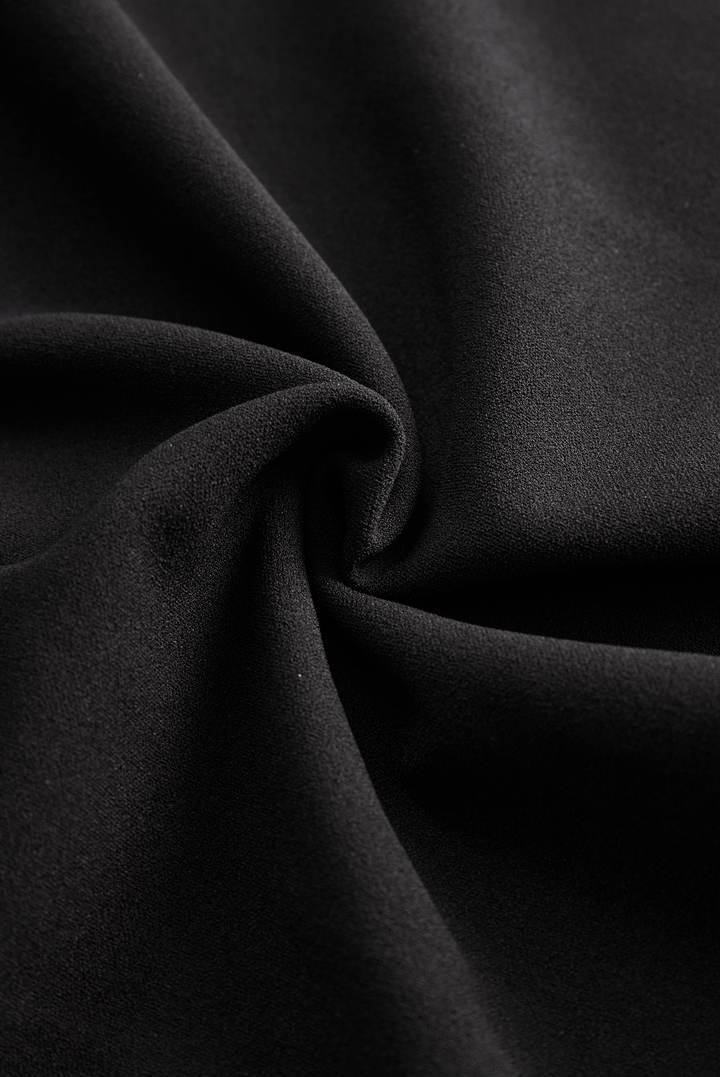 Confident stance in women's elegant midi graduation dress, featuring a mandarin collar and wrap front.
