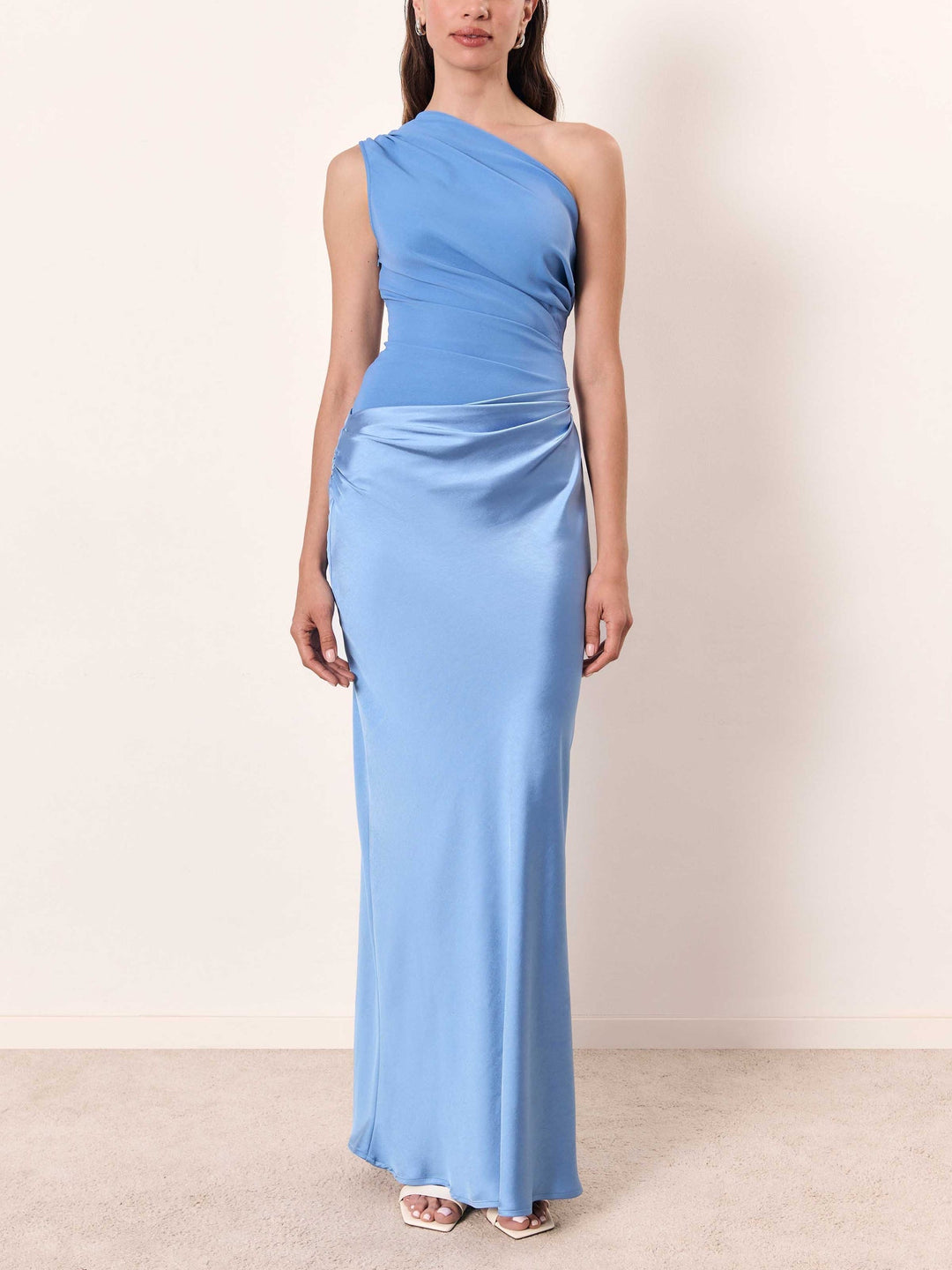 Stylish women's one-shoulder pleated maxi dress, a flattering and elegant choice for upscale parties.