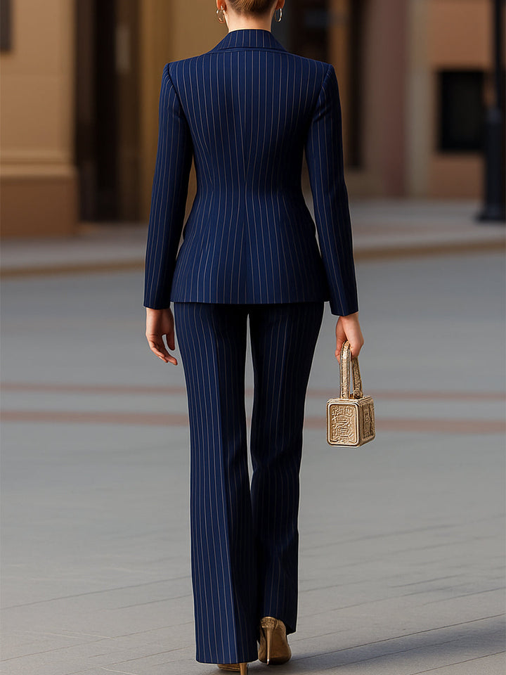 Stylish women's pinstripe power suit, a two-piece blazer and trouser set, for modern professional women's fashion.