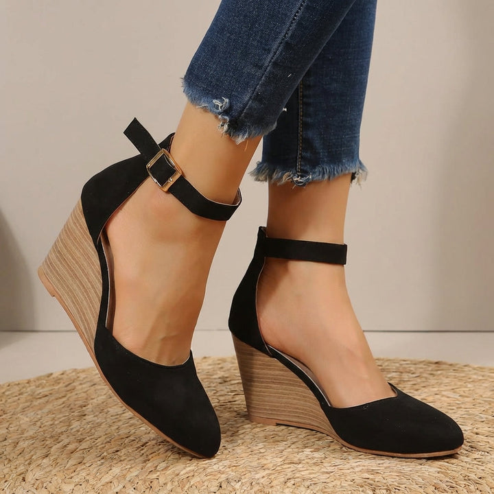 Elegant women's pointed toe wedge heels with secure ankle strap. Perfect comfortable dress shoes for versatile wear.