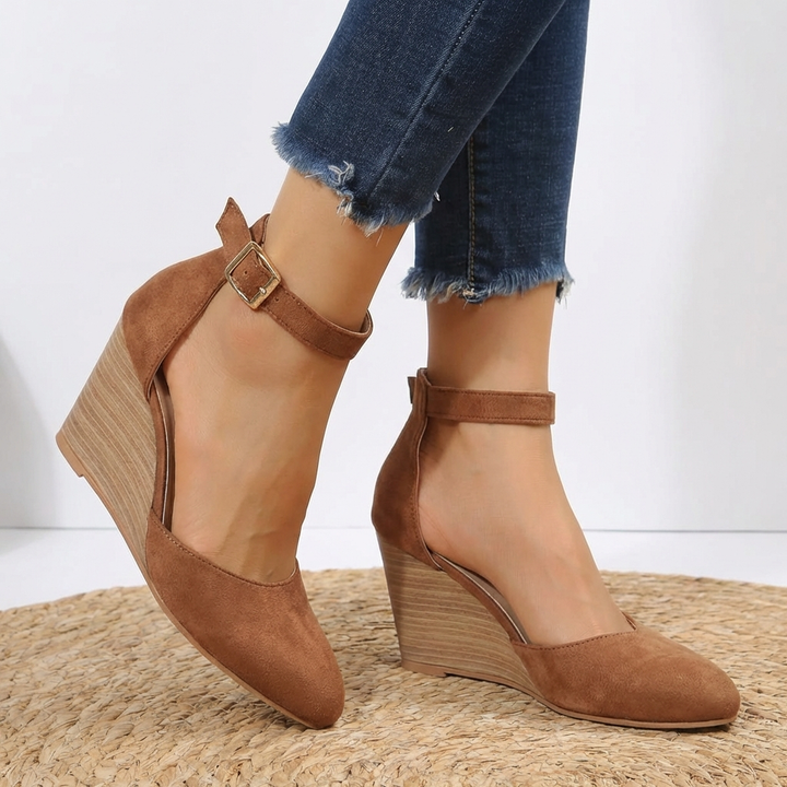 Stylish women's pointed toe wedge heels with delicate ankle strap. Versatile elegant footwear for formal or casual outfits.