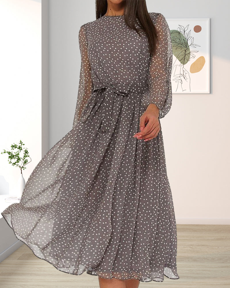 Stylish women's long sleeve A-line dress featuring a classic polka dot print. Knee-length and versatile for elegant comfort.