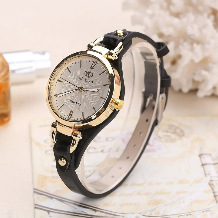 Minimalist ladies' quartz watch featuring a beautiful engraved dial and sleek vegan leather band.