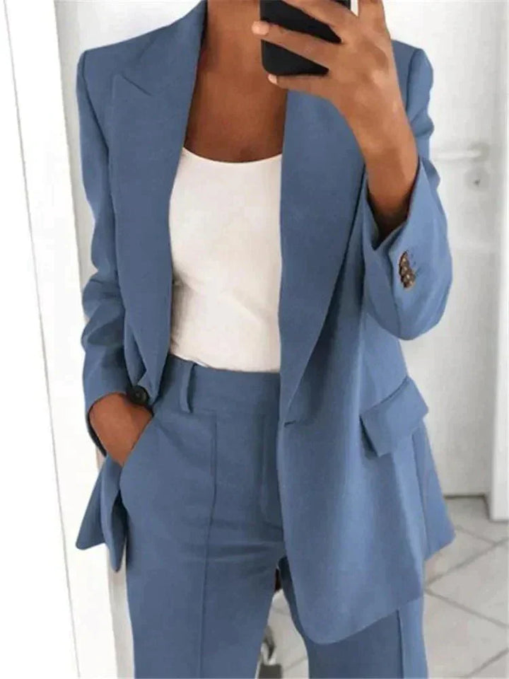 Elegant women's relaxed fit two-piece suit set with blazer and trousers, perfect for professional business attire.