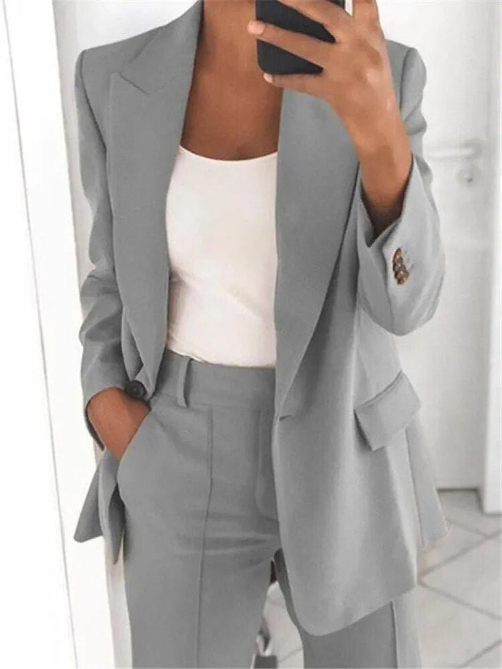 Women's two-piece suit set: relaxed fit blazer and trousers. Perfect for business, office, and formal wear.
