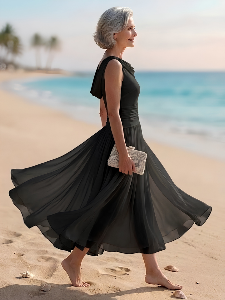 Beautiful women's A-line midi dress. Draped neck, pleated, sleeveless. Great for elegant parties & guests.