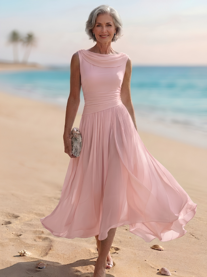 Sleeveless A-line midi dress, elegant pleated design for women. Ideal wedding guest & formal party wear.
