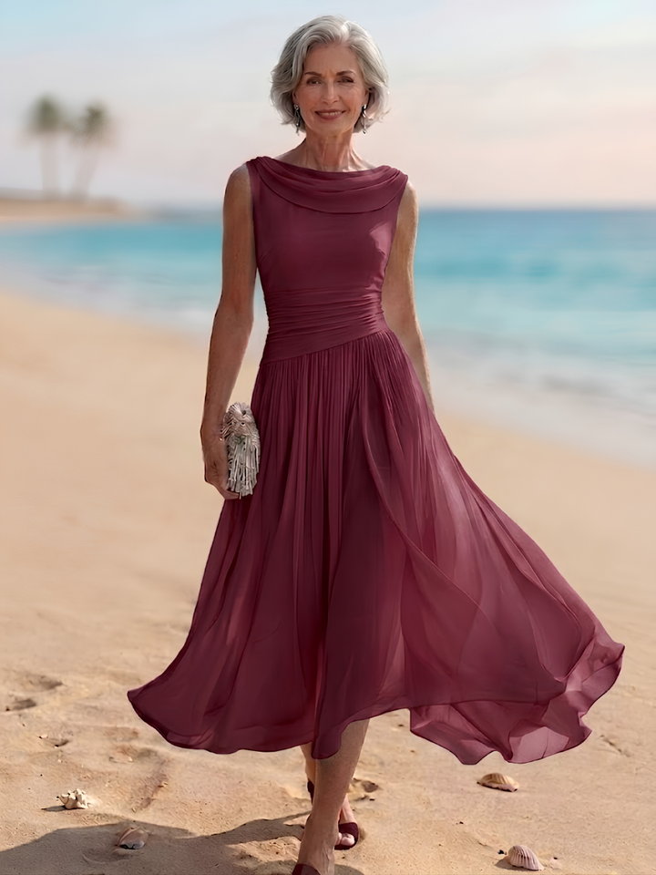 Formal women's A-line midi dress with draped neck & pleats. Elegant sleeveless design for special events.