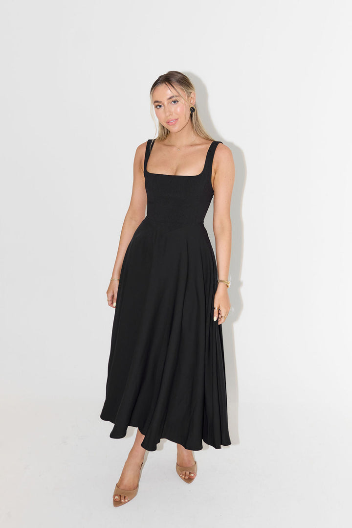 Flattering square neck sleeveless midi dress for women, an elegant summer essential for any wardrobe.