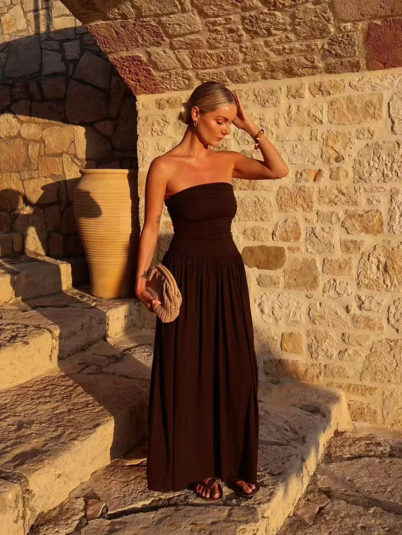 Long brown pleated maxi dress for women, elegant strapless design, ideal for special occasions.