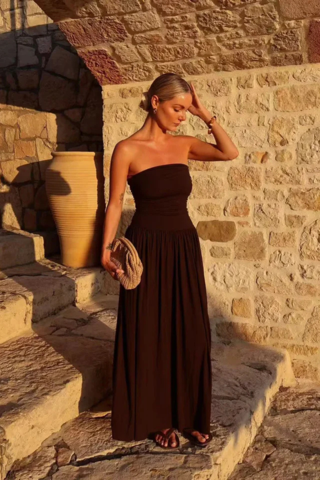 Chic brown strapless pleated maxi dress for women, ideal as an elegant summer or evening party dress.