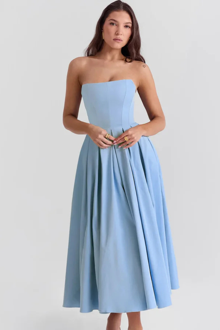 Women's elegant strapless cocktail midi dress with a cinched corset waist and a charming, full flared skirt.