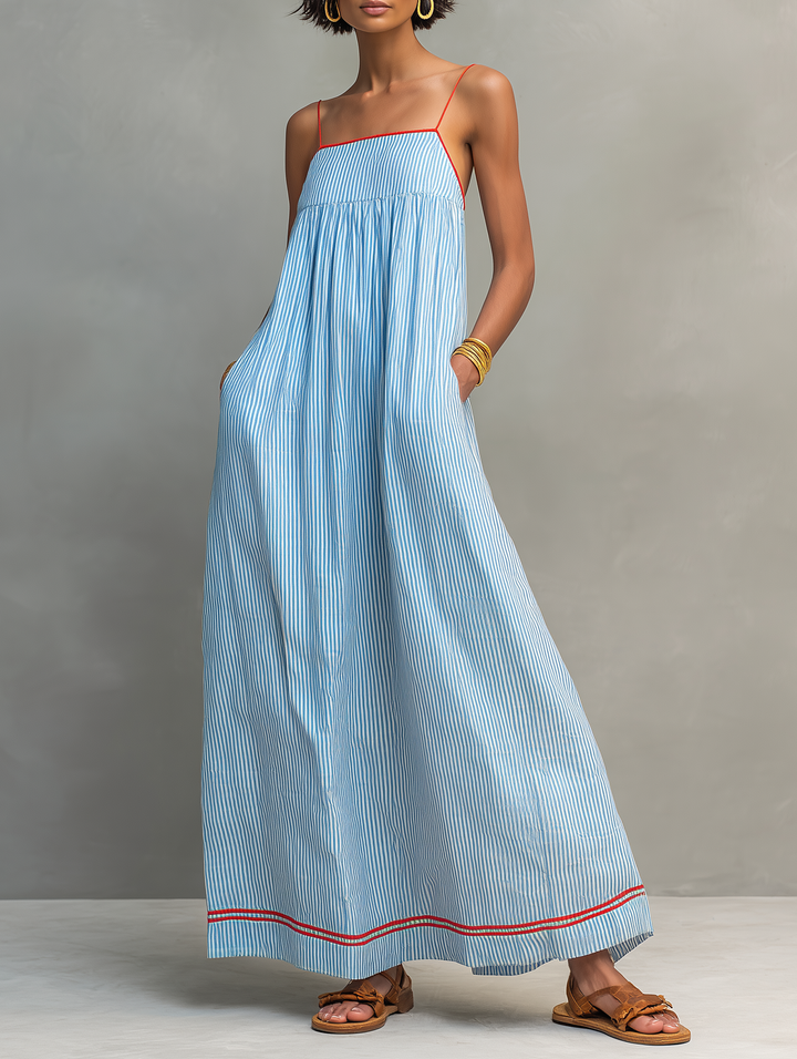Elegant women's striped maxi dress with spaghetti straps, perfect for summer casual or holiday wear.