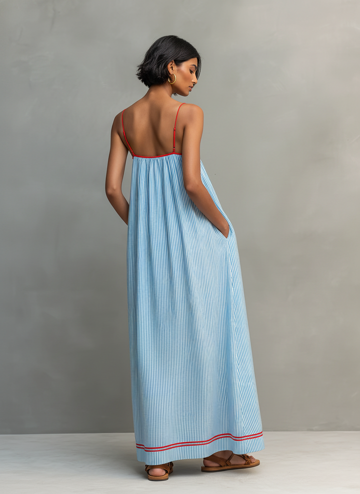 Women's sleeveless maxi dress featuring thin spaghetti straps and a chic striped pattern.
