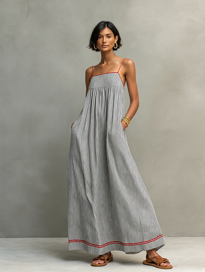 Gathered women's striped maxi dress with delicate spaghetti straps, an elegant choice for casual wear.