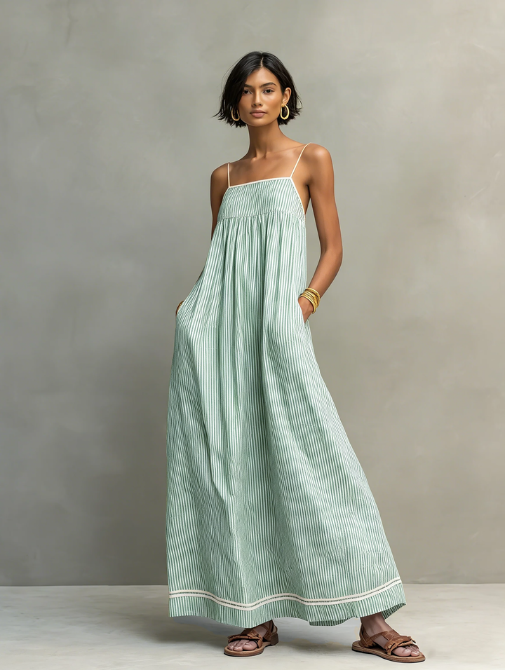 Long striped maxi dress for women, designed with elegant spaghetti straps for a sleek summer look.