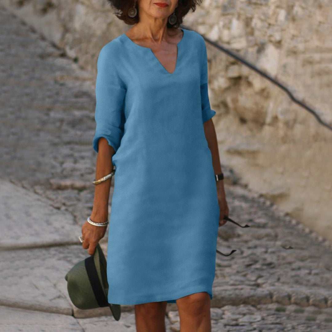 Versatile midi length summer dress, elegant and comfortable for women's everyday chic style.