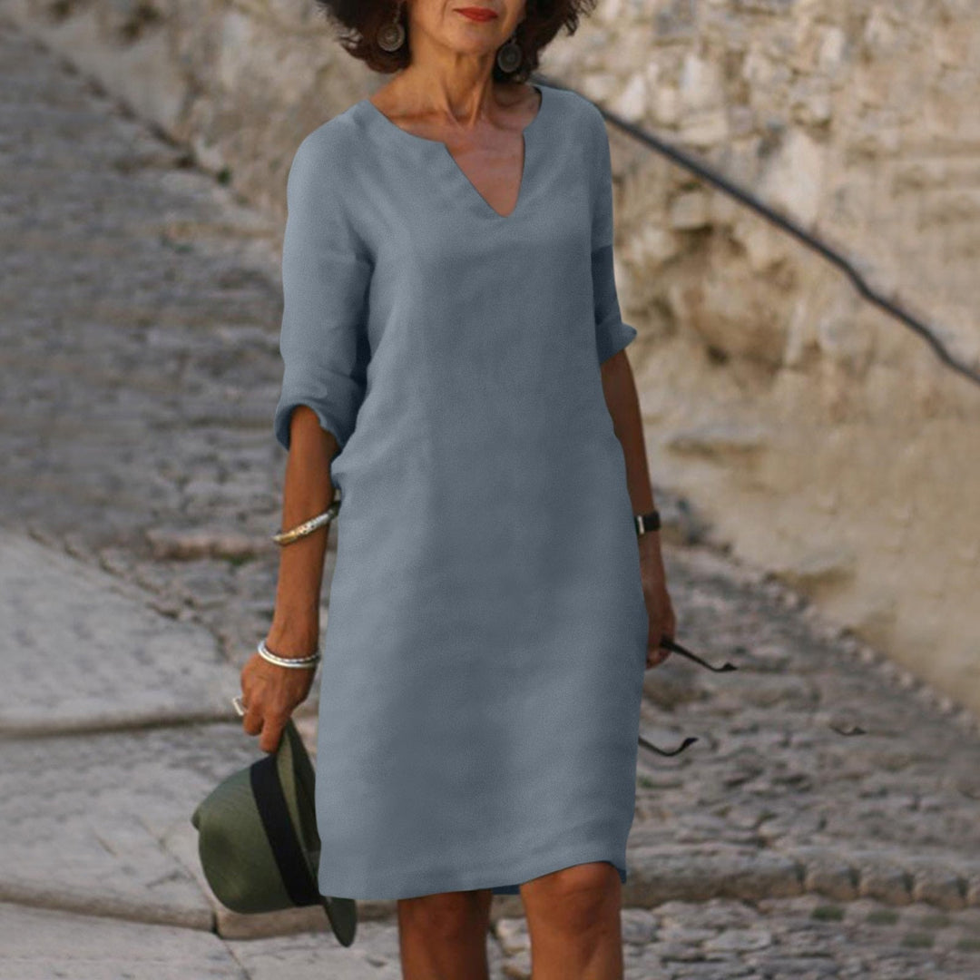Casual midi summer dress, ideal for holiday wear and relaxed, elegant styling.