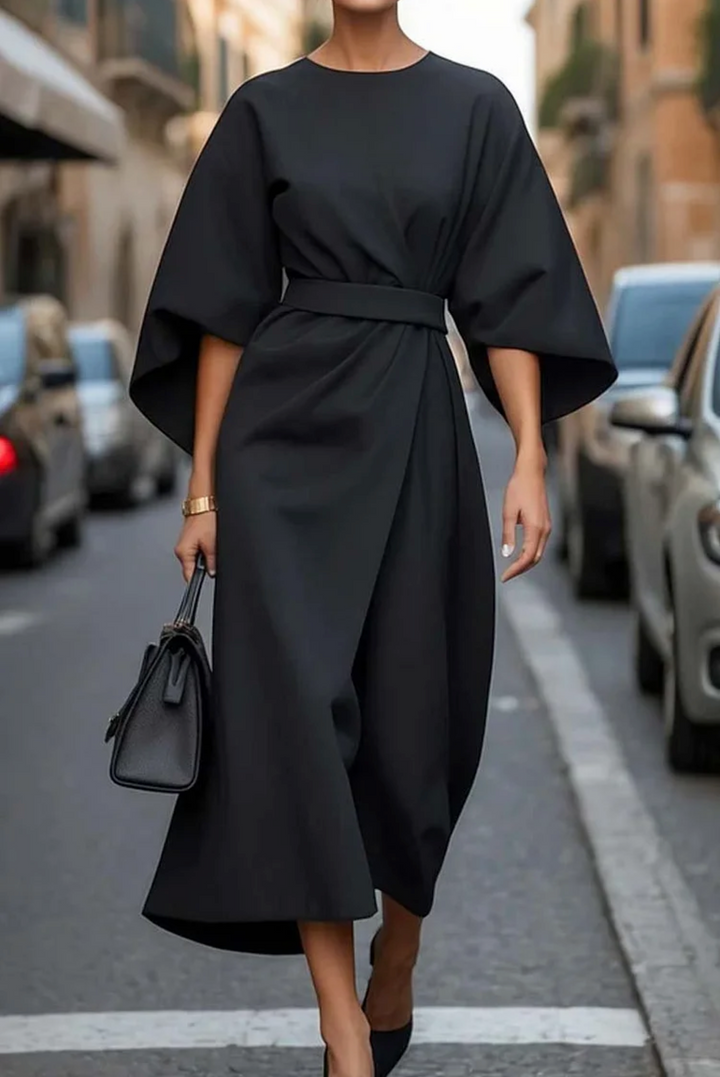 Beautiful women's elegant summer dress, midi length with a cinched belt and graceful wide sleeves.