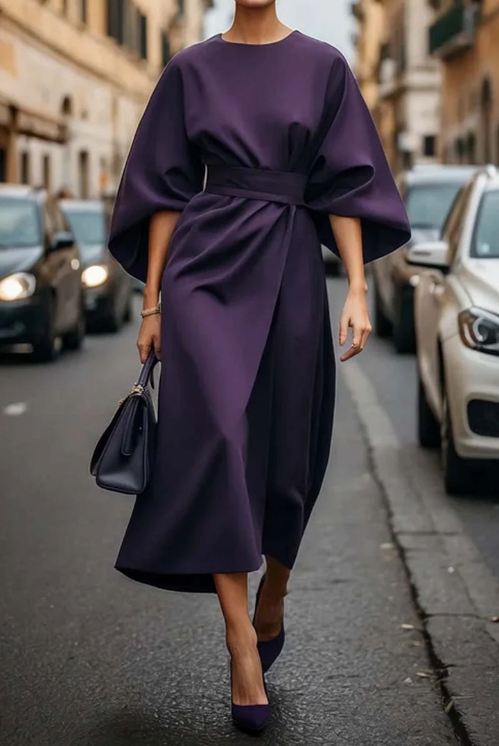 Stylish women's elegant summer dress, midi length, with a belt and wide sleeves for a sophisticated look.
