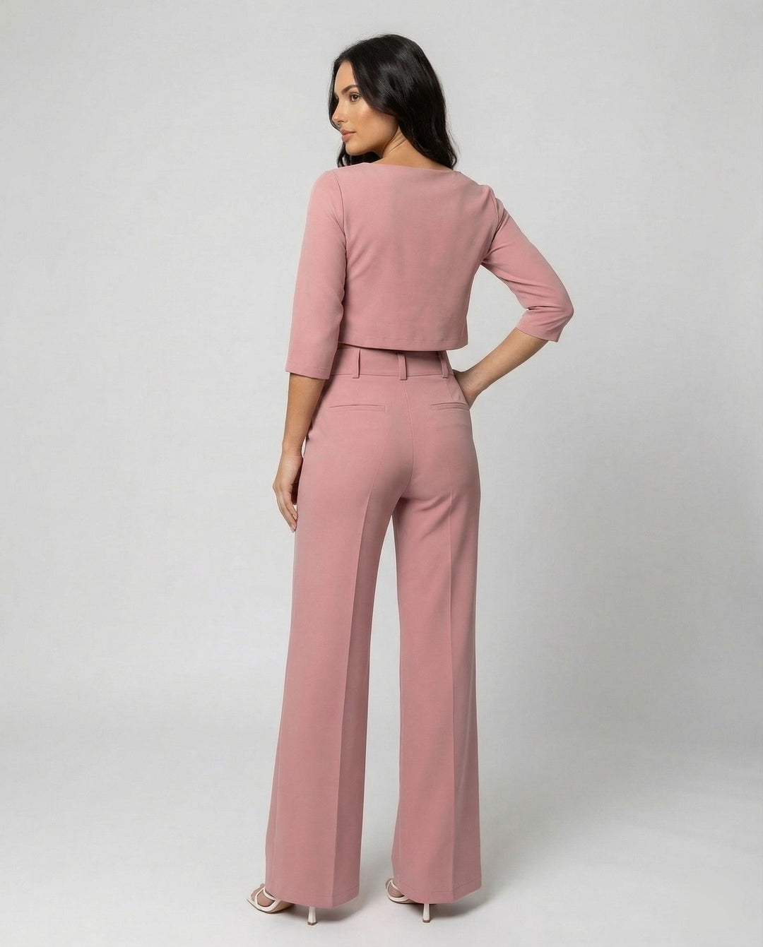 Chic women's two-piece tailored pants set featuring a stylish crop top and elegant elastic waist trousers.