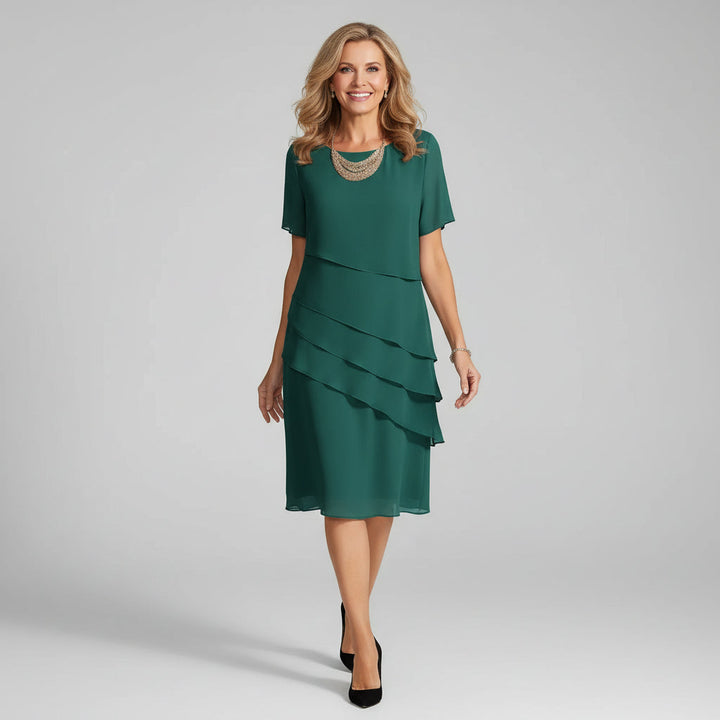 Chic women's tiered midi dress, suitable for mother of the bride, with an elegant, comfortable design.