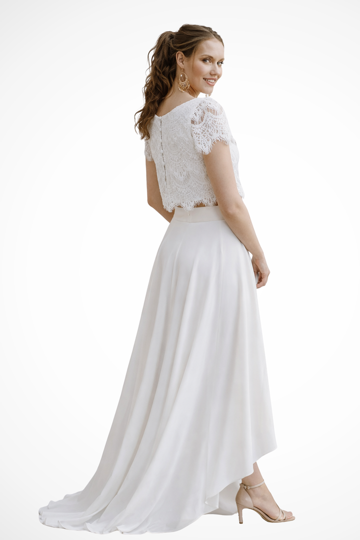 Sophisticated women's two-piece set with elegant top & flowing maxi skirt for formal and bridal events.