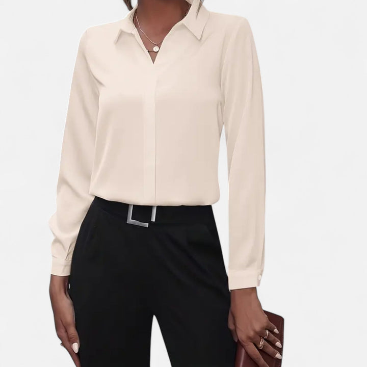 Effortlessly elegant women's V-neck button-up blouse. Long sleeve top, ideal for sophisticated office or casual style.