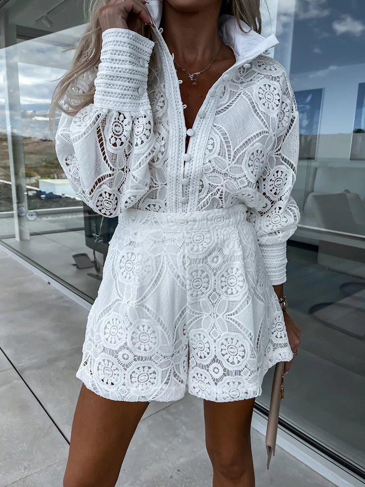 Elegant women's white lace long sleeve blouse & high-waist shorts set. Perfect for summer resort wear.