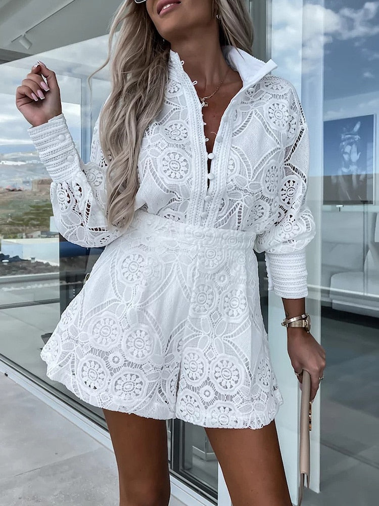 Stylish women's lace long sleeve blouse paired with high-waist shorts. Elegant 2-piece summer set.