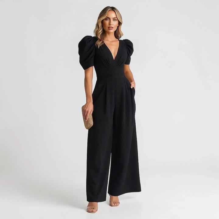 Fashionable women's one-piece wide leg jumpsuit featuring elegant puff sleeves. Great for parties.