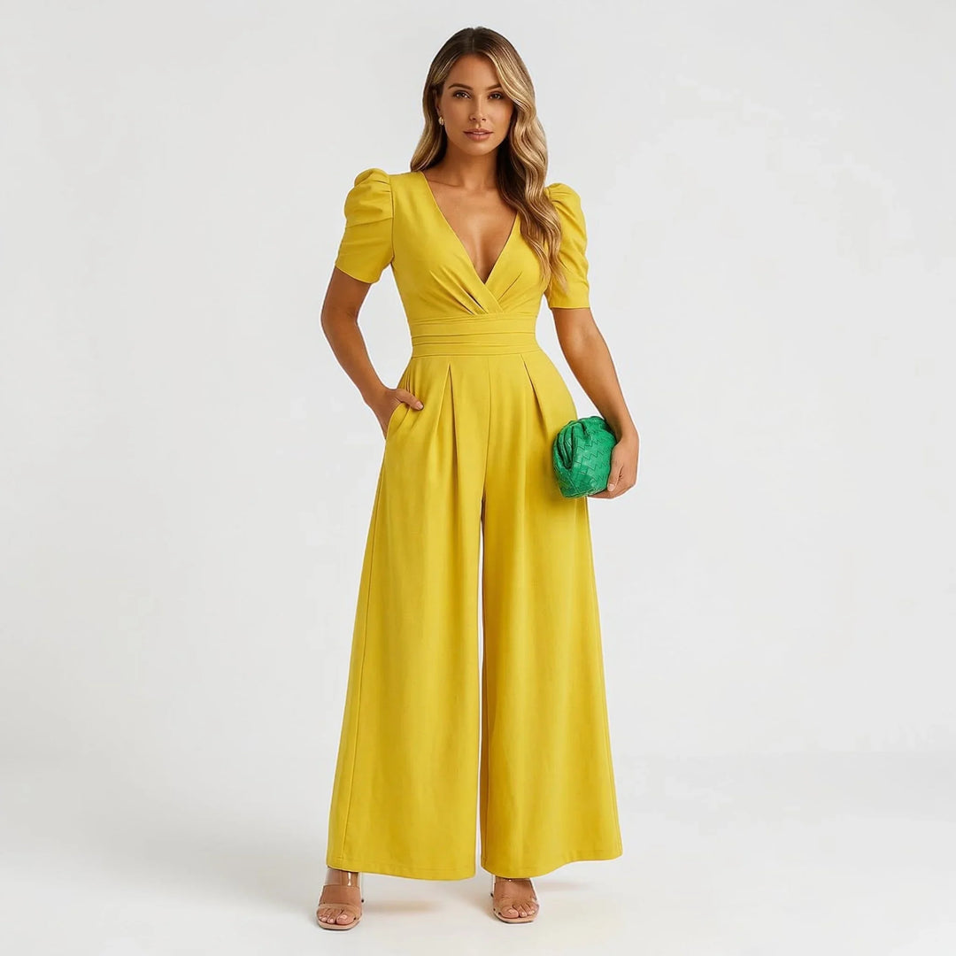 Formal women's wide leg jumpsuit with puff sleeves, an elegant and stylish option for wedding guests.
